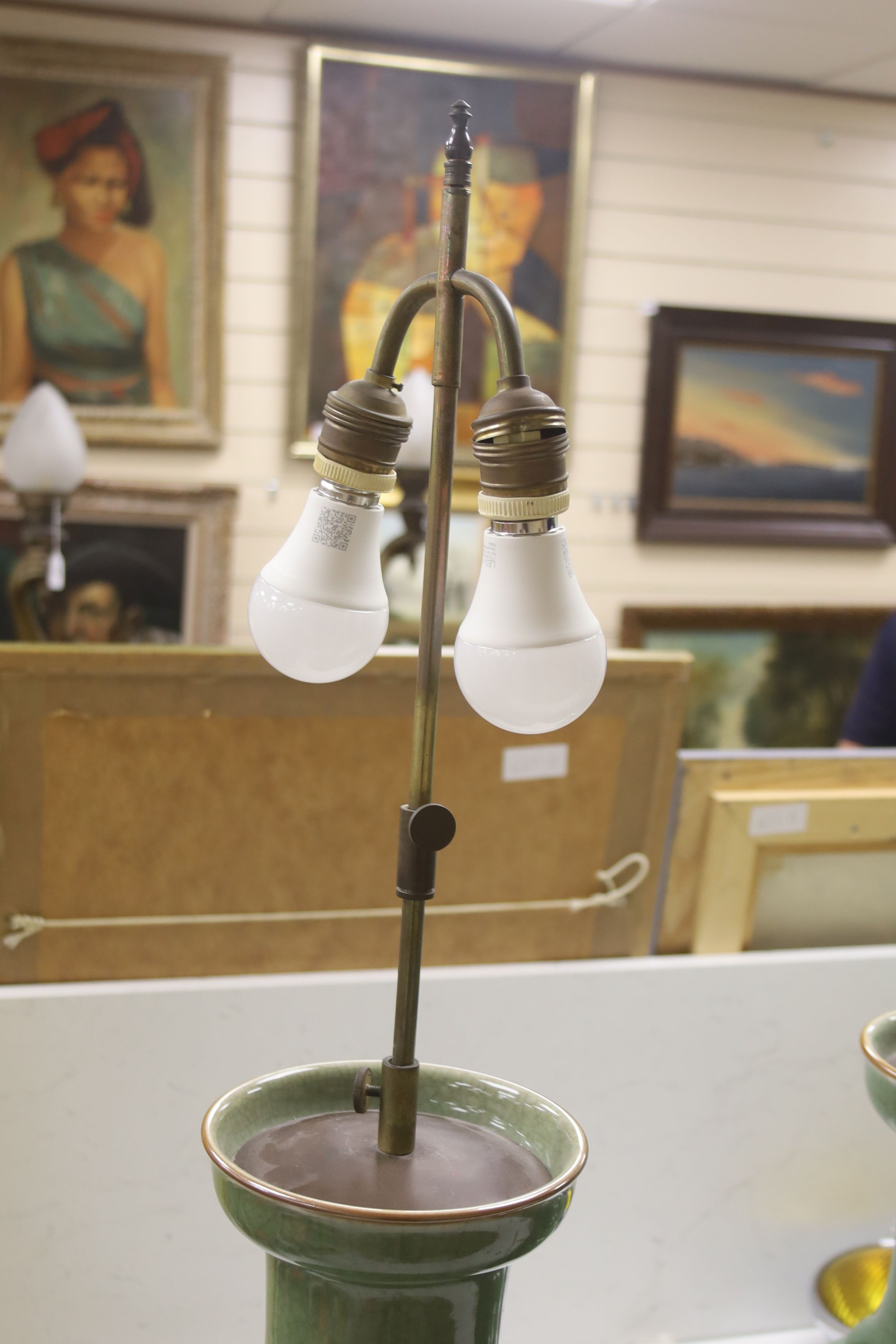 A pair of Chinese celadon crackle glazed table lamps, height 46cm excluding light fitting